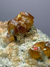 Load image into Gallery viewer, Hessonite Garnet Cluster on Matrix – Natural Collector Specimen from Pakistan | High-Grade Orange-Red Garnet Crystals