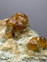 Load image into Gallery viewer, Hessonite Garnet Cluster on Matrix – Natural Collector Specimen from Pakistan | High-Grade Orange-Red Garnet Crystals