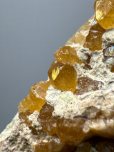 Load image into Gallery viewer, Hessonite Garnet Cluster on Matrix – Natural Collector Specimen from Pakistan | High-Grade Orange-Red Garnet Crystals