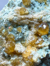 Load image into Gallery viewer, Hessonite Garnet Cluster on Matrix – Natural Collector Specimen from Pakistan | High-Grade Orange-Red Garnet Crystals
