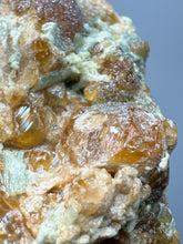Load image into Gallery viewer, Hessonite Garnet Cluster on Matrix – Natural Collector Specimen from Pakistan | High-Grade Orange-Red Garnet Crystals
