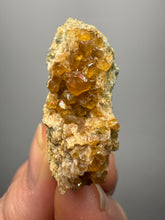 Load image into Gallery viewer, Hessonite Garnet Cluster on Matrix – Natural Collector Specimen from Pakistan | High-Grade Orange-Red Garnet Crystals

