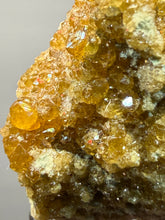 Load image into Gallery viewer, Hessonite Garnet Cluster on Matrix – Natural Collector Specimen from Pakistan | High-Grade Orange-Red Garnet Crystals
