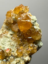 Load image into Gallery viewer, Hessonite Garnet Cluster on Matrix – Thumbnail Collector Specimen from Pakistan | High-Grade Orange-Red Garnet Crystals
