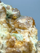 Load image into Gallery viewer, Hessonite Garnet Cluster on Matrix – Natural Collector Specimen from Pakistan | High-Grade Orange-Red Garnet Crystals

