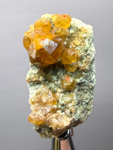 Load image into Gallery viewer, Hessonite Garnet Cluster on Matrix – Natural Collector Specimen from Pakistan | High-Grade Orange-Red Garnet Crystals
