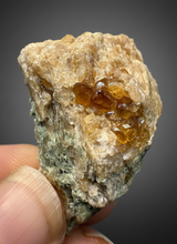 Load image into Gallery viewer, Hessonite Garnet Cluster on Matrix – Natural Collector Specimen from Pakistan | High-Grade Orange-Red Garnet Crystals
