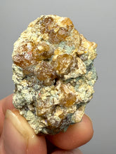Load image into Gallery viewer, Hessonite Garnet Cluster on Matrix – Natural Collector Specimen from Pakistan | High-Grade Orange-Red Garnet Crystals
