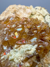 Load image into Gallery viewer, Hessonite Garnet Cluster on Matrix – Natural Collector Specimen from Pakistan | High-Grade Orange-Red Garnet Crystals
