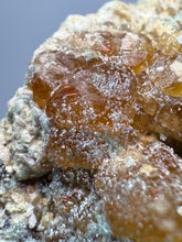 Load image into Gallery viewer, Hessonite Garnet Cluster on Matrix – Natural Collector Specimen from Pakistan | High-Grade Orange-Red Garnet Crystals
