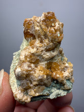 Load image into Gallery viewer, Hessonite Garnet Cluster on Matrix – Natural Collector Specimen from Pakistan | High-Grade Orange-Red Garnet Crystals
