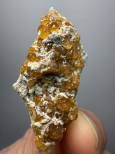 Load image into Gallery viewer, Hessonite Garnet Cluster on Matrix – Natural Collector Specimen from Pakistan | High-Grade Orange-Red Garnet Crystals
