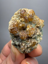 Load image into Gallery viewer, Hessonite Garnet Cluster on Matrix – Natural Collector Specimen from Pakistan | High-Grade Orange-Red Garnet Crystals
