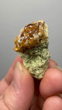 Load and play video in Gallery viewer, Hessonite Garnet Cluster on Matrix – Natural Collector Specimen from Pakistan | High-Grade Orange-Red Garnet Crystals
