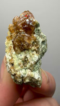 Load and play video in Gallery viewer, Hessonite Garnet Cluster on Matrix – Natural Collector Specimen from Pakistan | High-Grade Orange-Red Garnet Crystals
