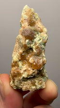 Load and play video in Gallery viewer, Hessonite Garnet Cluster on Matrix – Natural Collector Specimen from Pakistan | High-Grade Orange-Red Garnet Crystals
