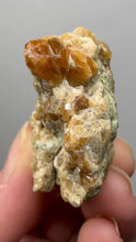 Load and play video in Gallery viewer, Hessonite Garnet Cluster on Matrix – Natural Collector Specimen from Pakistan | High-Grade Orange-Red Garnet Crystals
