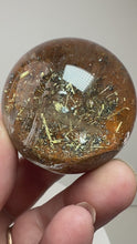 Load and play video in Gallery viewer, Garden Quartz Golden Rutile and/or Cubic Golden Pyrite Sphere • High Grade • RARE
