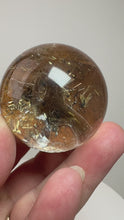 Load and play video in Gallery viewer, Garden Quartz Golden Rutile and/or Cubic Golden Pyrite Sphere • High Grade • RARE
