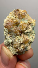 Load and play video in Gallery viewer, Hessonite Garnet Cluster on Matrix – Natural Collector Specimen from Pakistan | High-Grade Orange-Red Garnet Crystals
