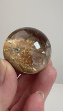 Load and play video in Gallery viewer, Garden Quartz Golden Rutile and/or Cubic Golden Pyrite Sphere • High Grade • RARE
