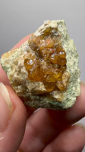 Load and play video in Gallery viewer, Hessonite Garnet Cluster on Matrix – Natural Collector Specimen from Pakistan | High-Grade Orange-Red Garnet Crystals
