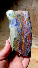 Load and play video in Gallery viewer, PREMIUM SELF STANDING DISPLAY or LAPIDARY SLAB • Moroccan “Dream Landscape Jagate” (Purple, Teal, Red, Green, Red, Yellow &amp; Orange Moss Plume Agate + Jasper) Stone End Cap • High Atlas Mountains • Unpolished
