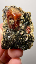 Load and play video in Gallery viewer, Naturally Faceted Zircon Crystal on Pegmatite–Biotite Matrix • Pakistan Mineral Specimen
